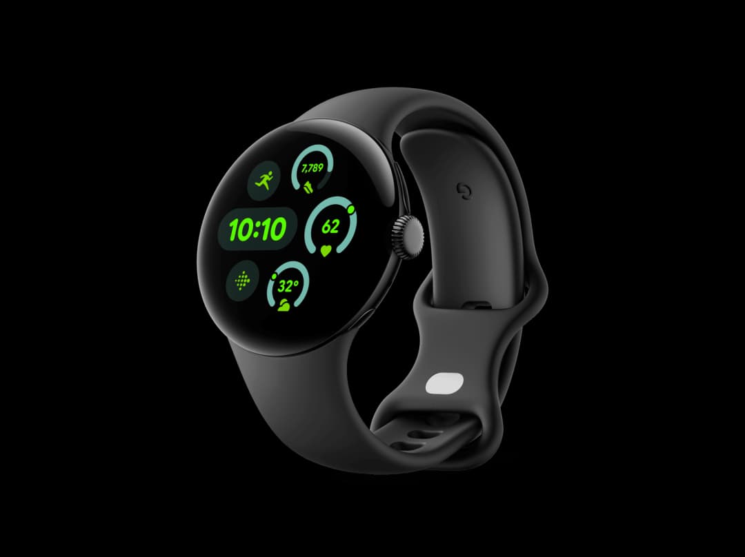 a black smartwatch showing a green thing on screen